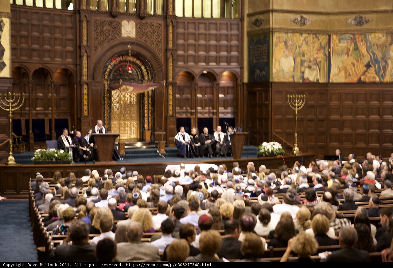 The Throngs Gather in a Grand Auditorium
