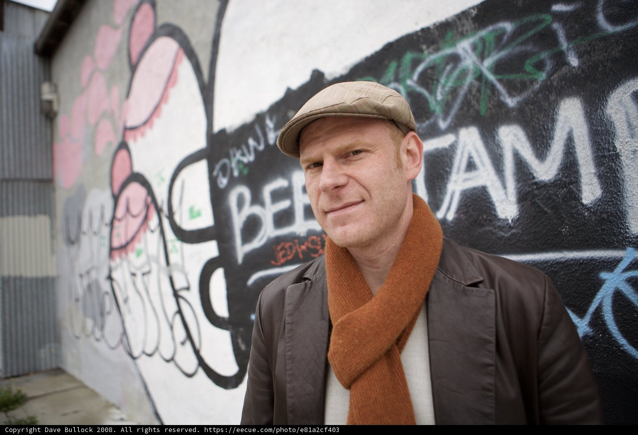 Junkie XL Poses in Front of Graffiti Wall