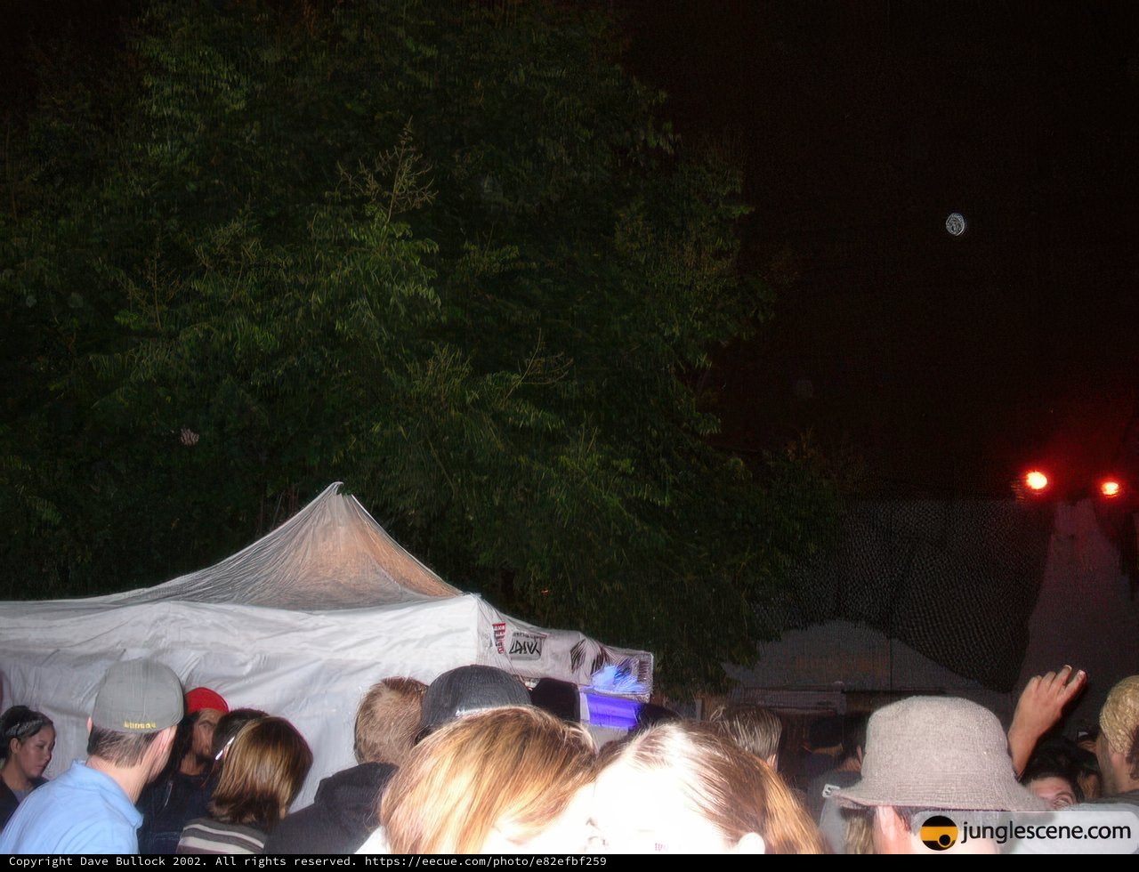 Illuminated Tent in a Concert Crowd