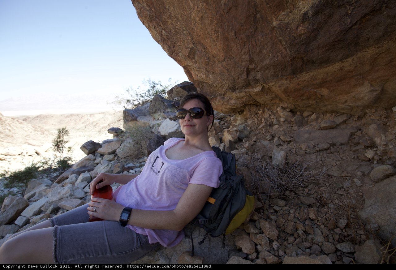 Desert Hiker Resting in Rocky Canyon Shade