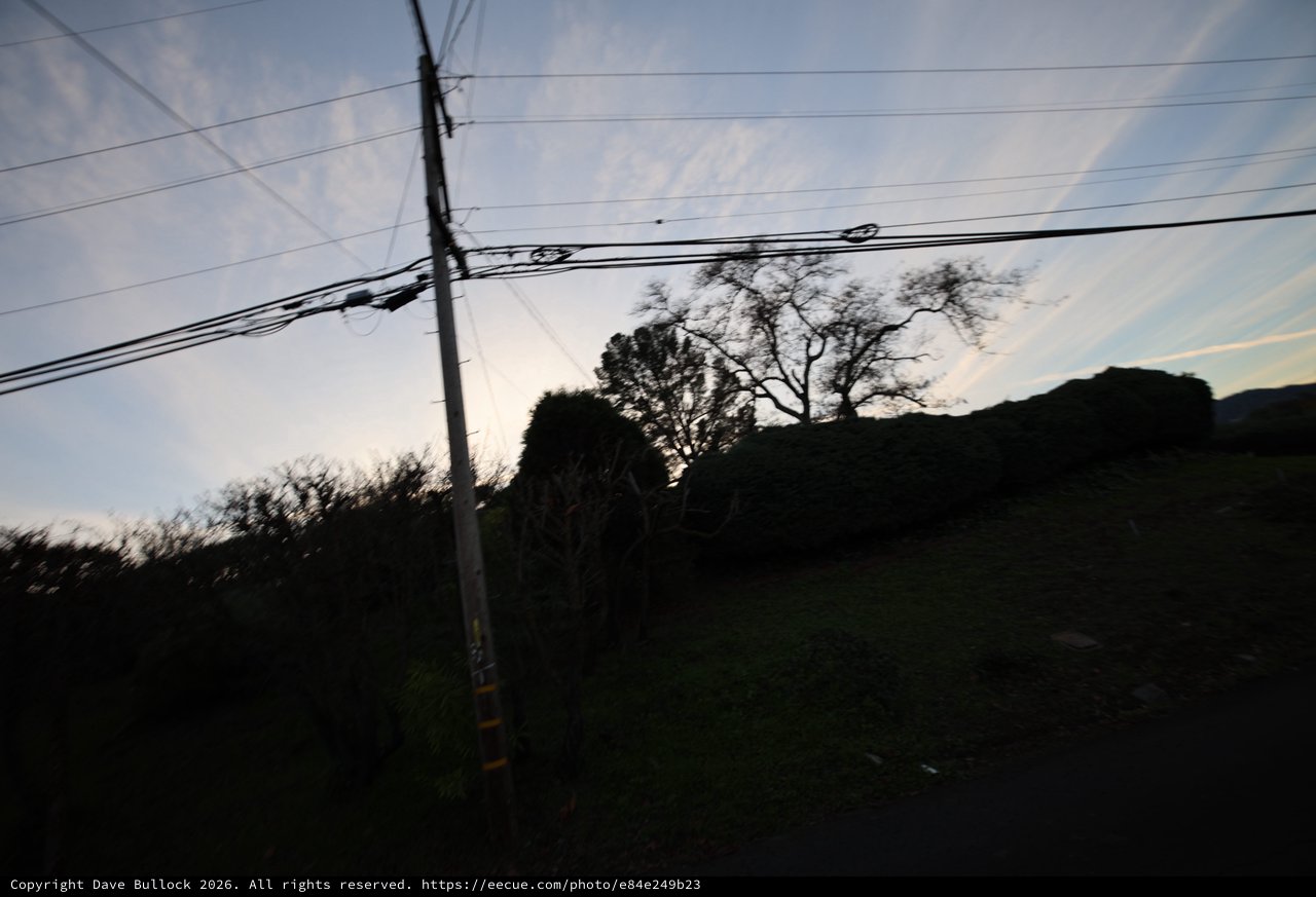 Dusk Silhouettes Along Rural Power Lines