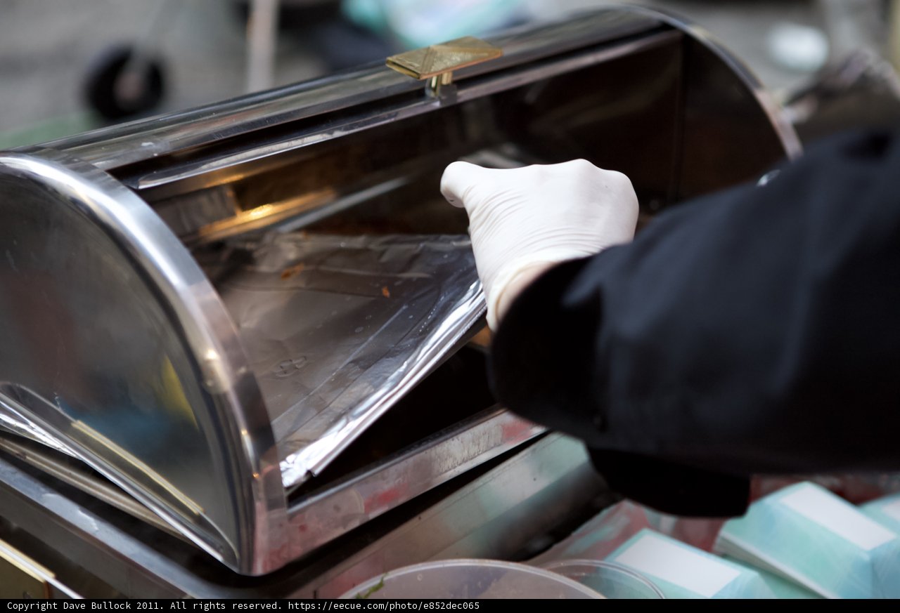 Gloved Hand Preparing Plata Wine