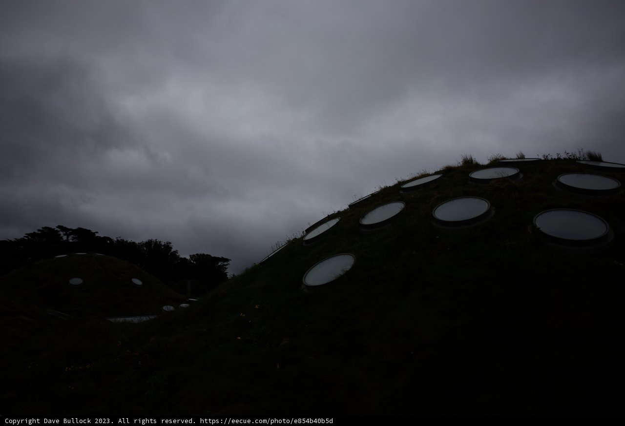 Enigmatic Windows on a Grassy Hill
