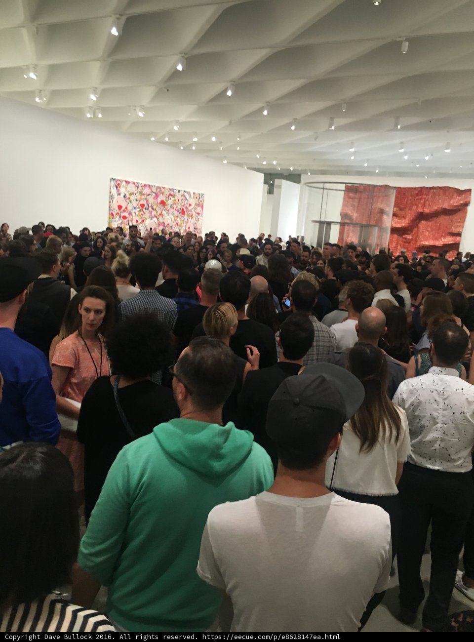 Art Gallery Crowd Gathers Around Painting