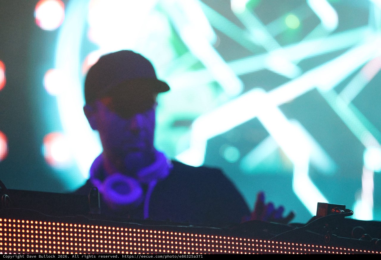 DJ Silhouette Bathed in Neon Stage Lights