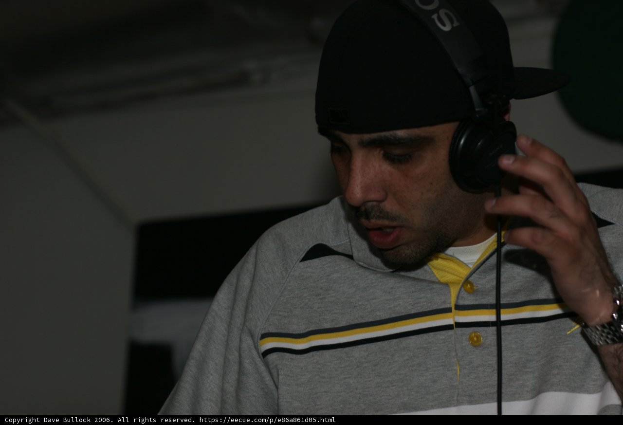 Grey-shirted Eric S: Rocking the Cap and Headphones