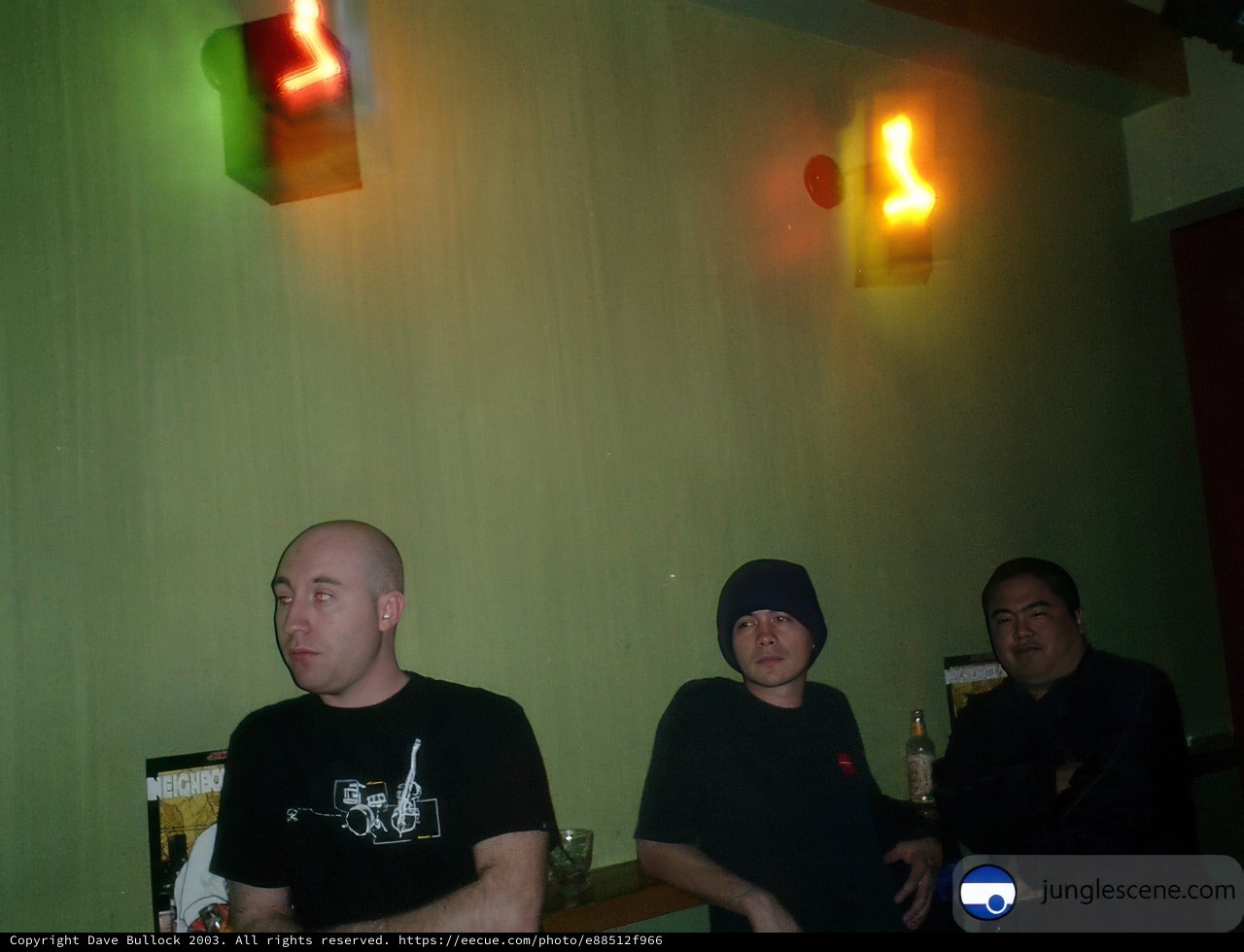 Three Men at the Neon-Lit Bar