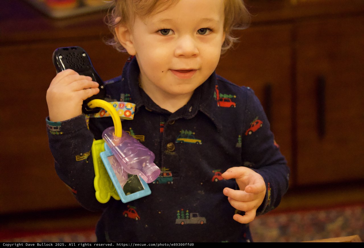 Toddler Playing with Toy Keys at Christmas