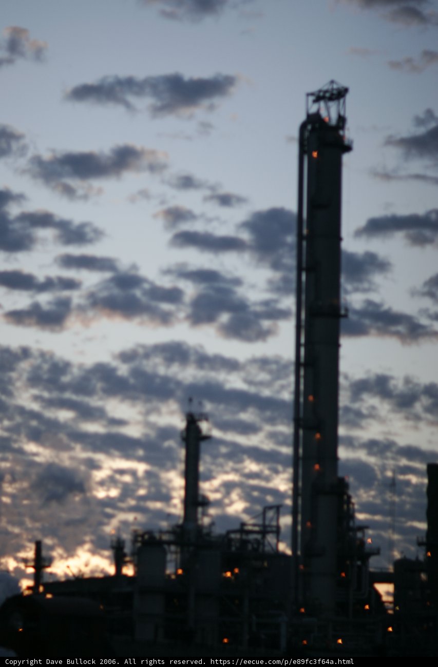 Towering Refinery against a Blue Sky