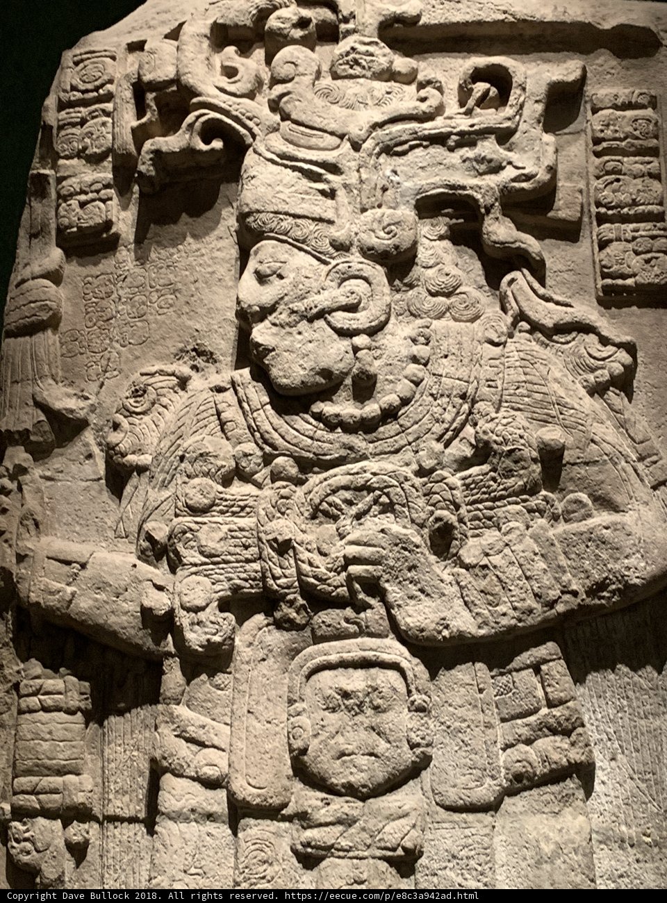Ancient Stone Carving of a Headdressed Man in a Monastery