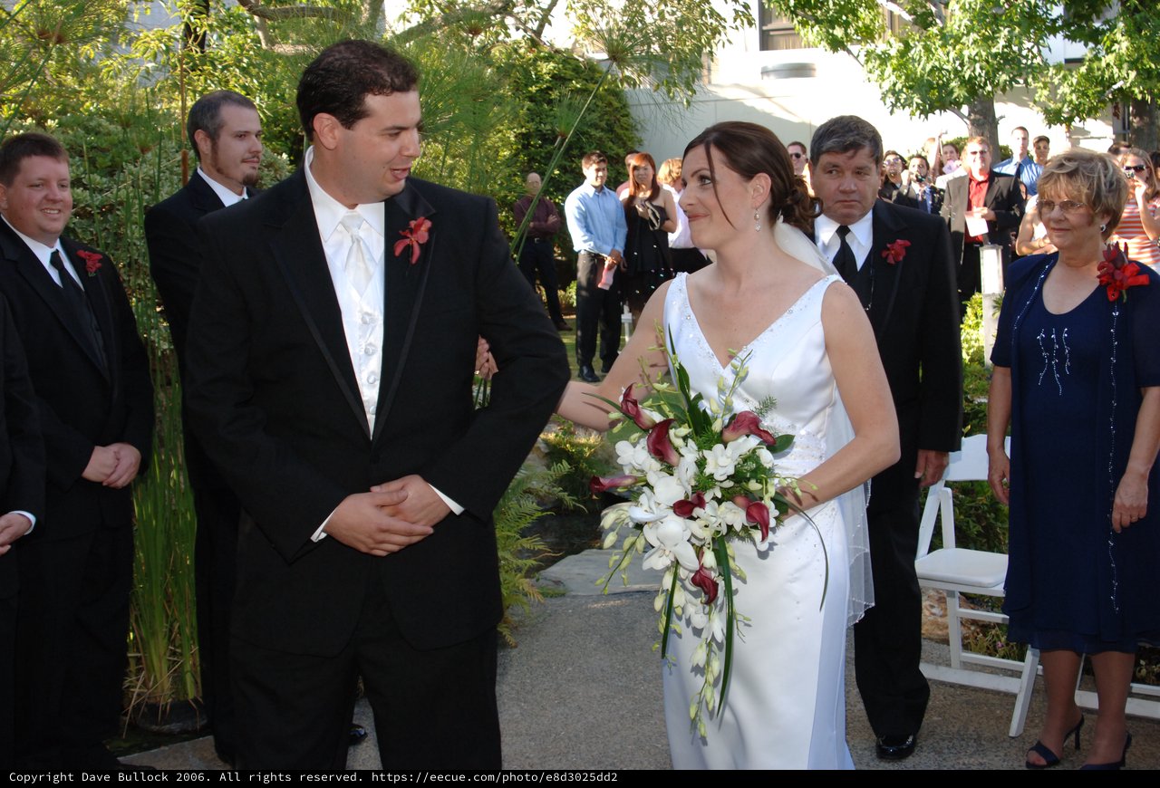 Bride and Groom Share Joyful Moment at Outdoor Wedding