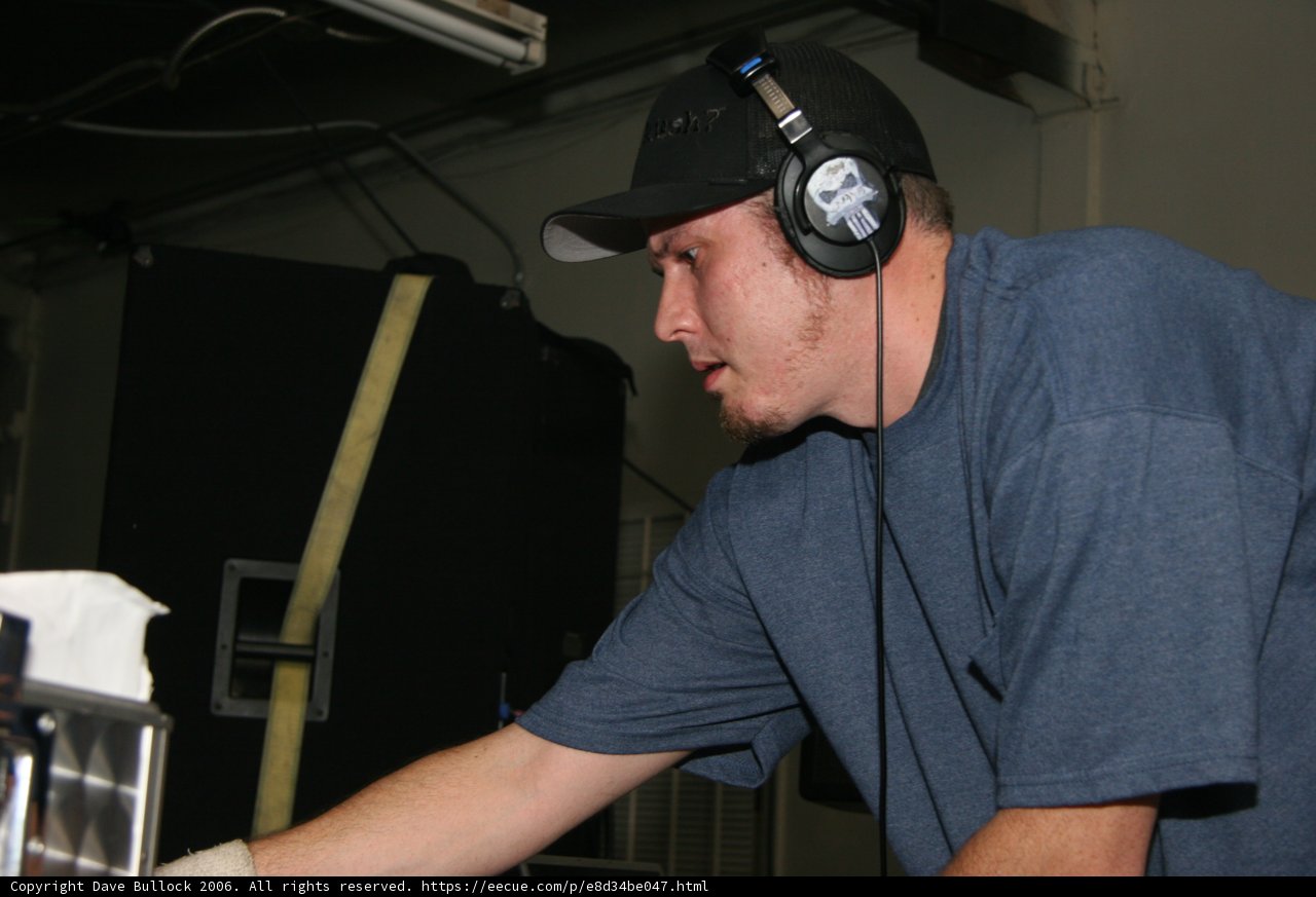 Blue Shirt, Baseball Cap, and Headphones