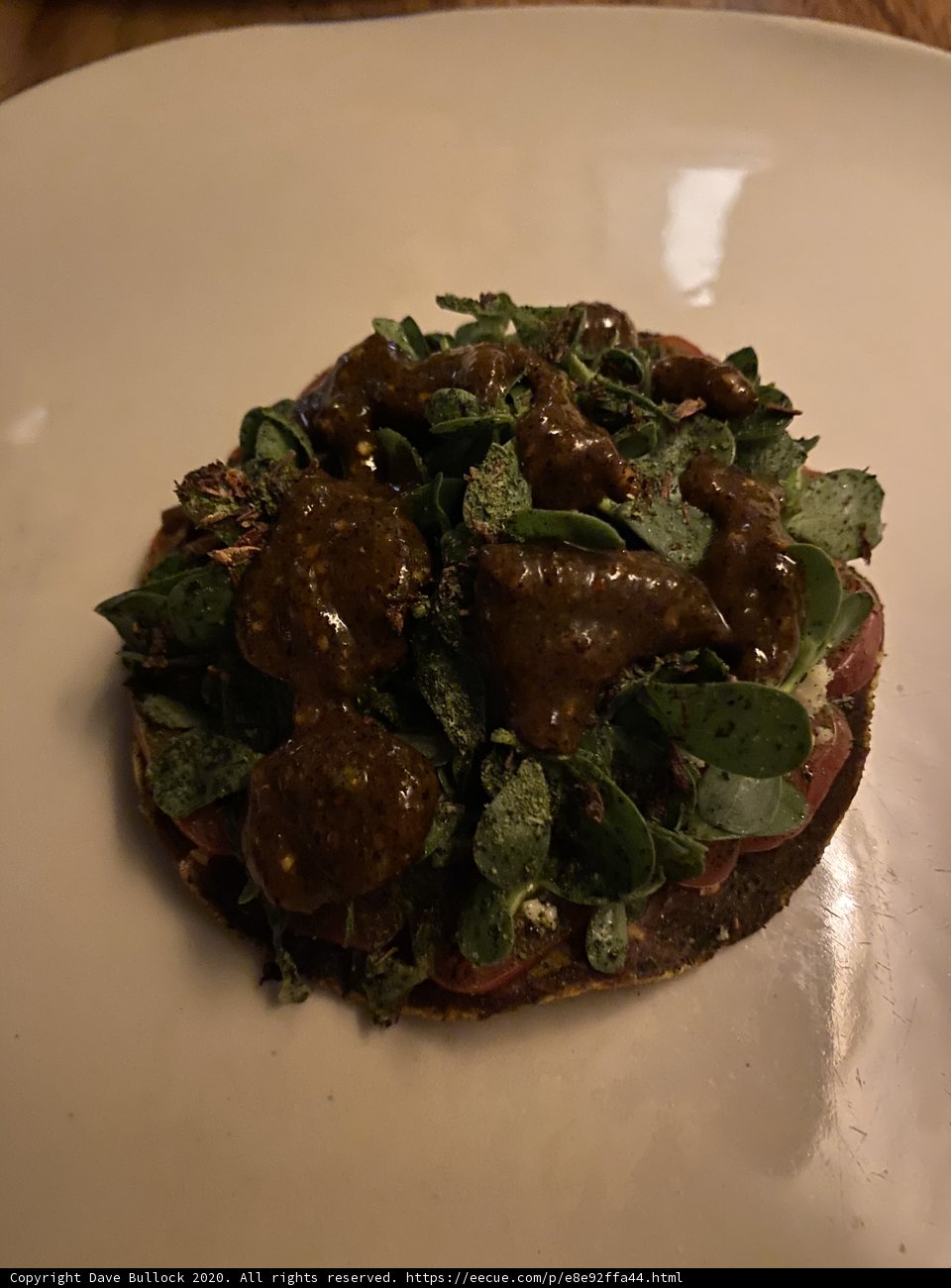 Delicious Pizza Topped with Meat and Greens