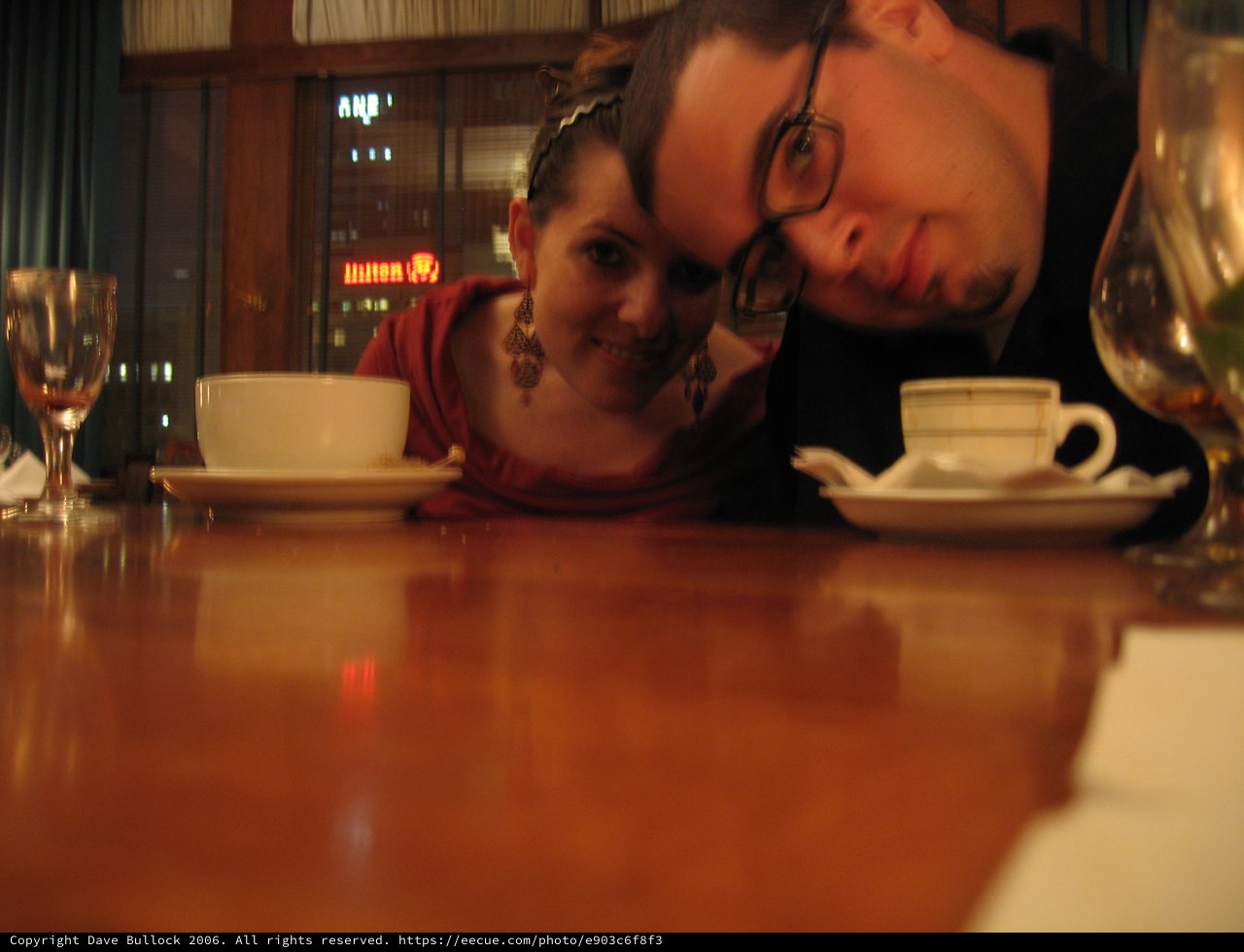 Couple Sharing an Intimate Moment at Restaurant Table