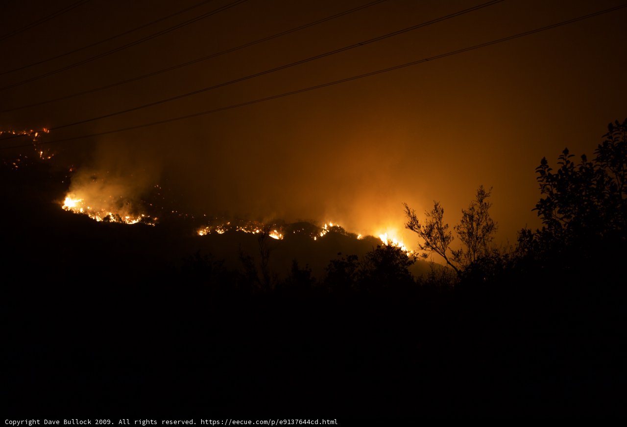 Flames Illuminate Night Sky Amid Station Fire