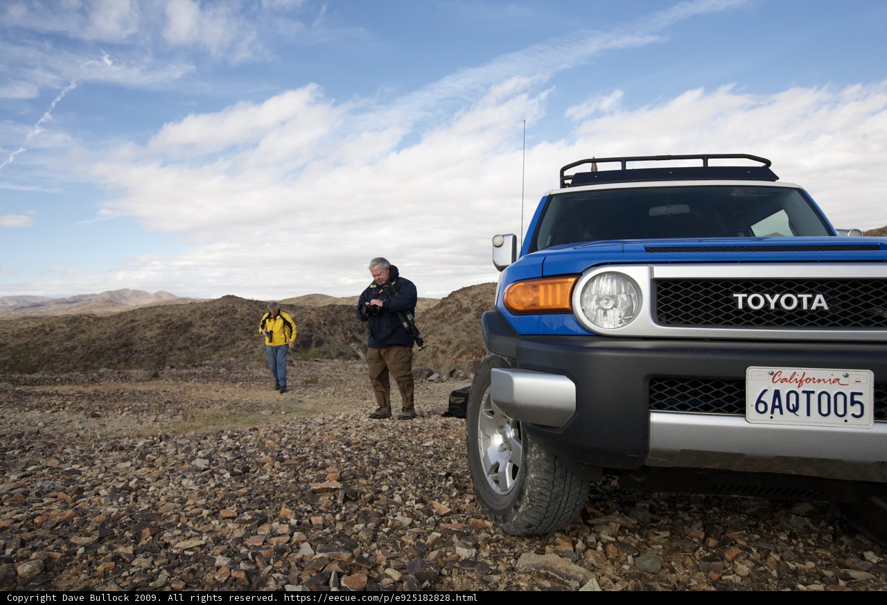 Blue Toyota Truck on a Gravel Road
