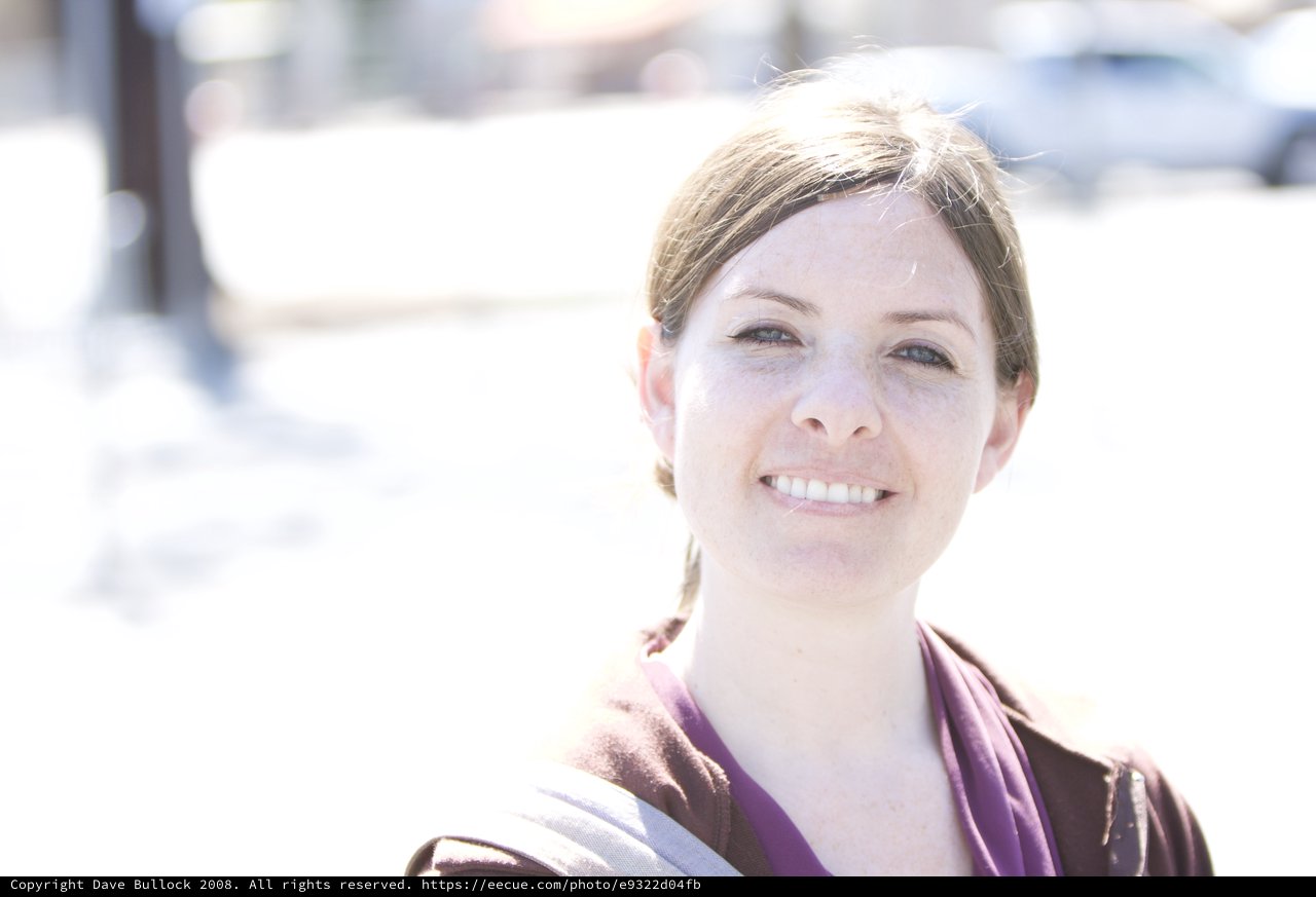 Smiling Woman Outdoors in Bright Natural Light
