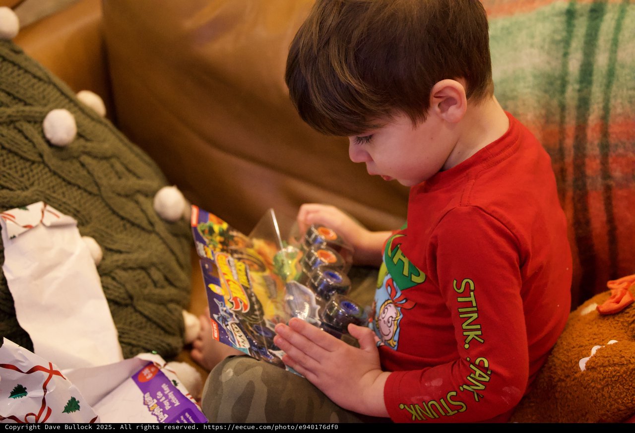 Child Opening LEGO Gift on Christmas Morning