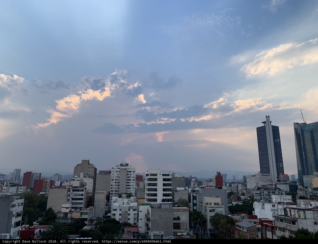 Urban Skyscrapers Under a Cloudy Sky