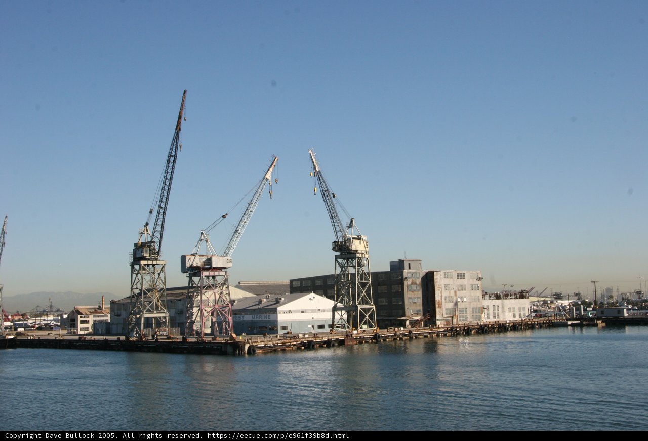 Busy Harbor with Cranes and Ships
