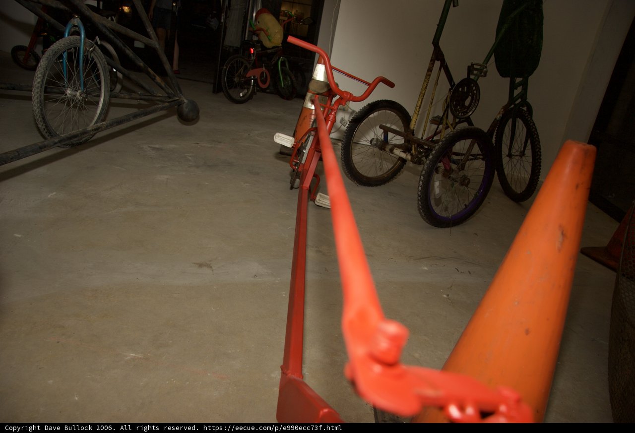 Red Bicycle on Orange Cone
