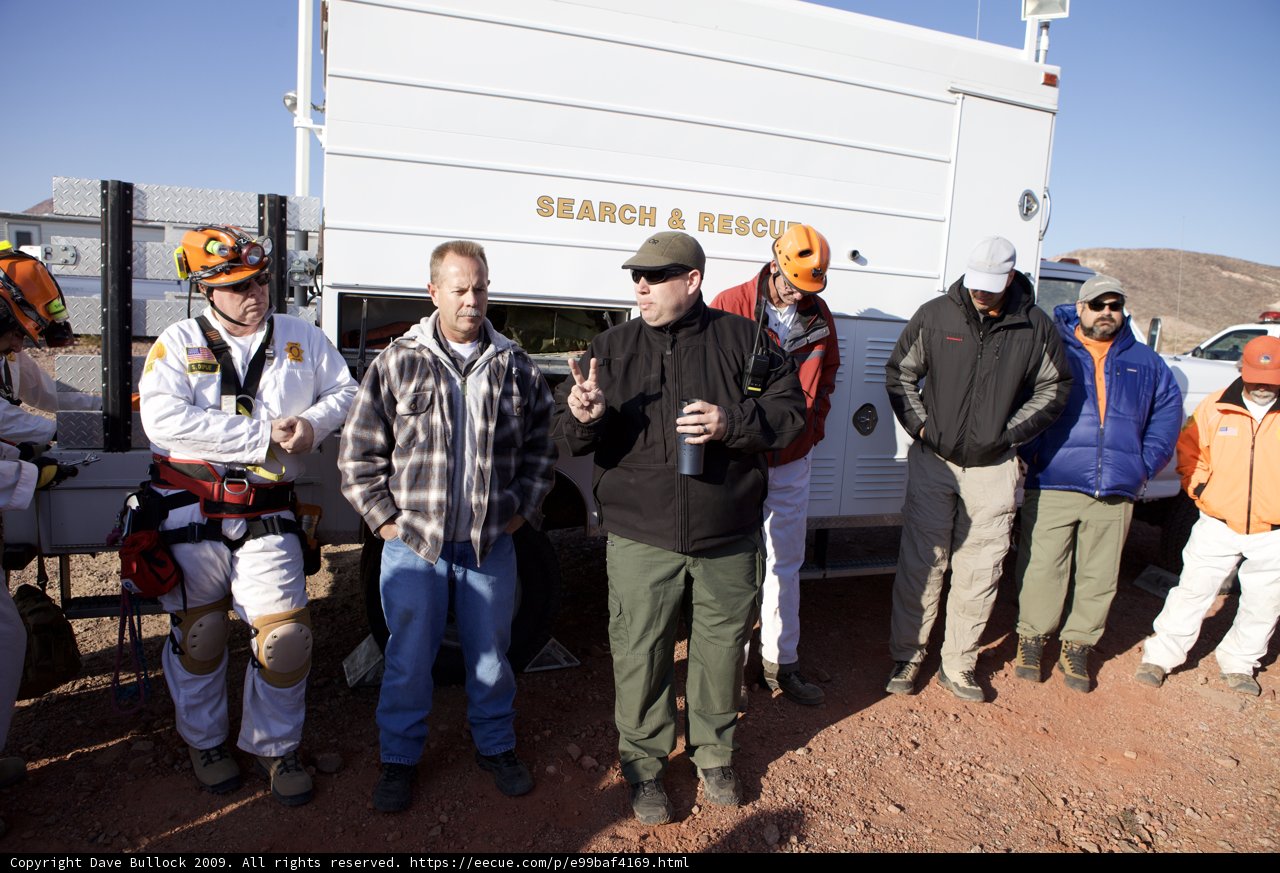 Rescuers Posing with White Truck