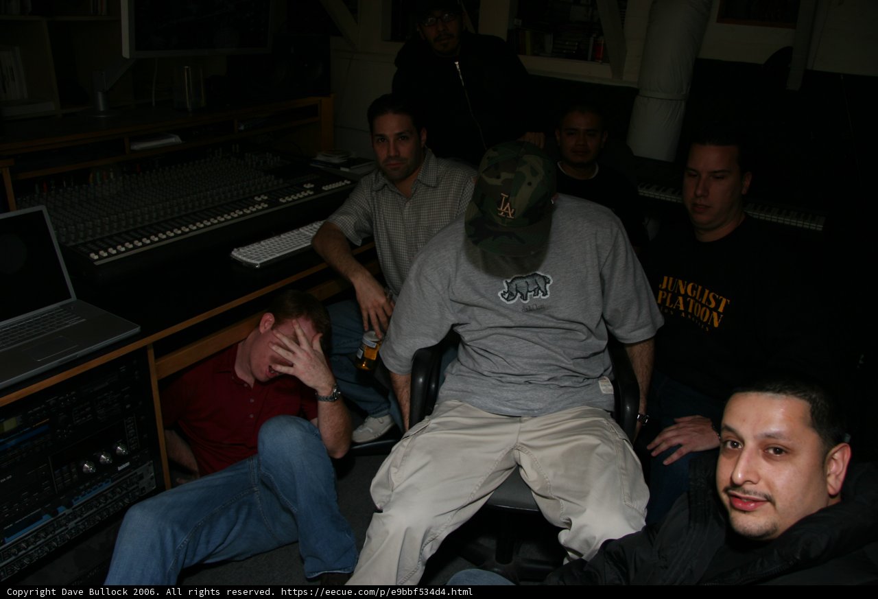 Man Sitting in Studio with Laptop and Accessories