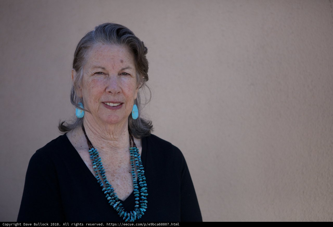Smiling Senior Lady with Stylish Necklace and Earrings
