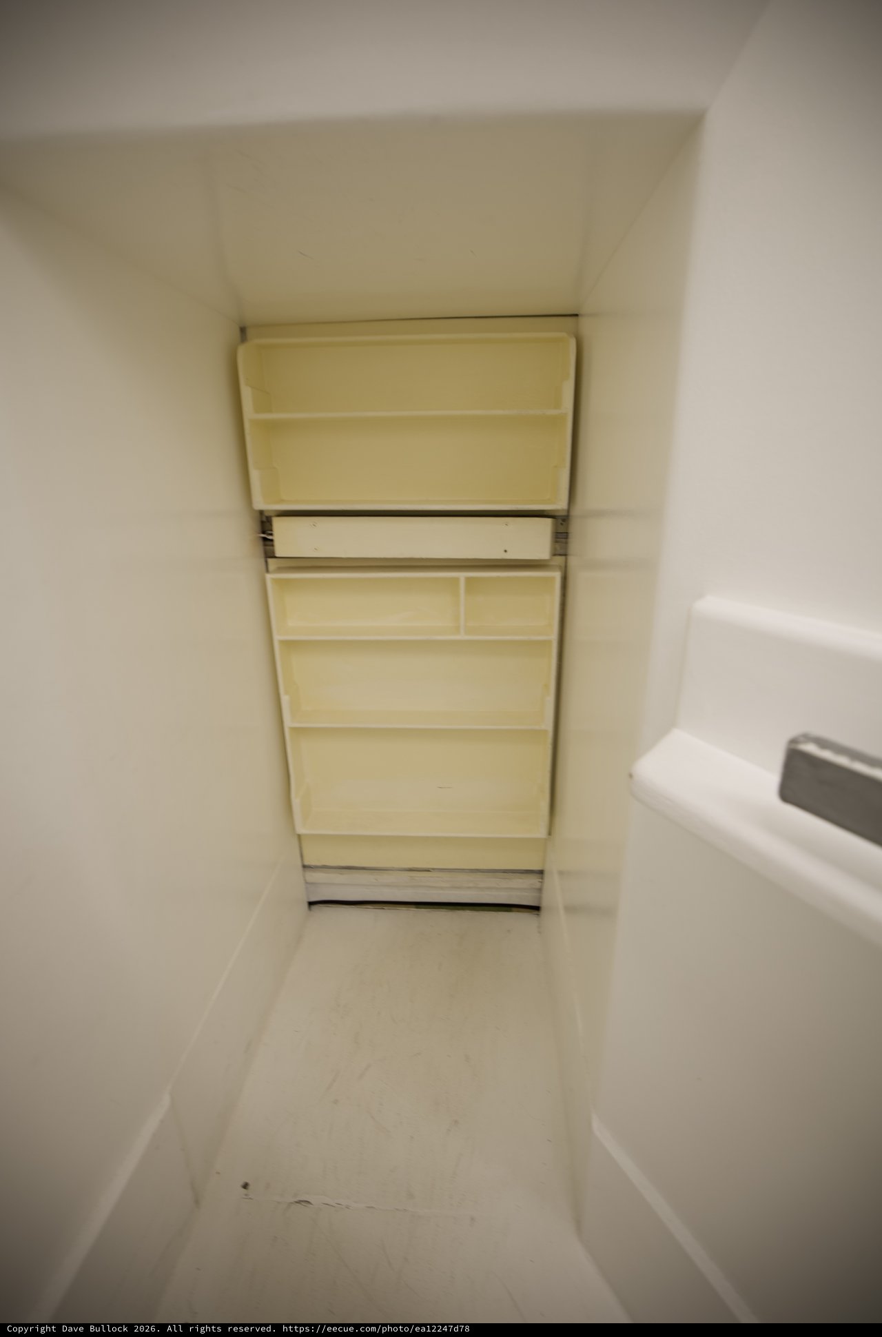 Compact Bathroom Storage Solution in Alcove