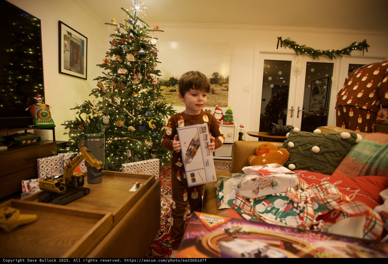 Child Opening Christmas Presents on Christmas Morning