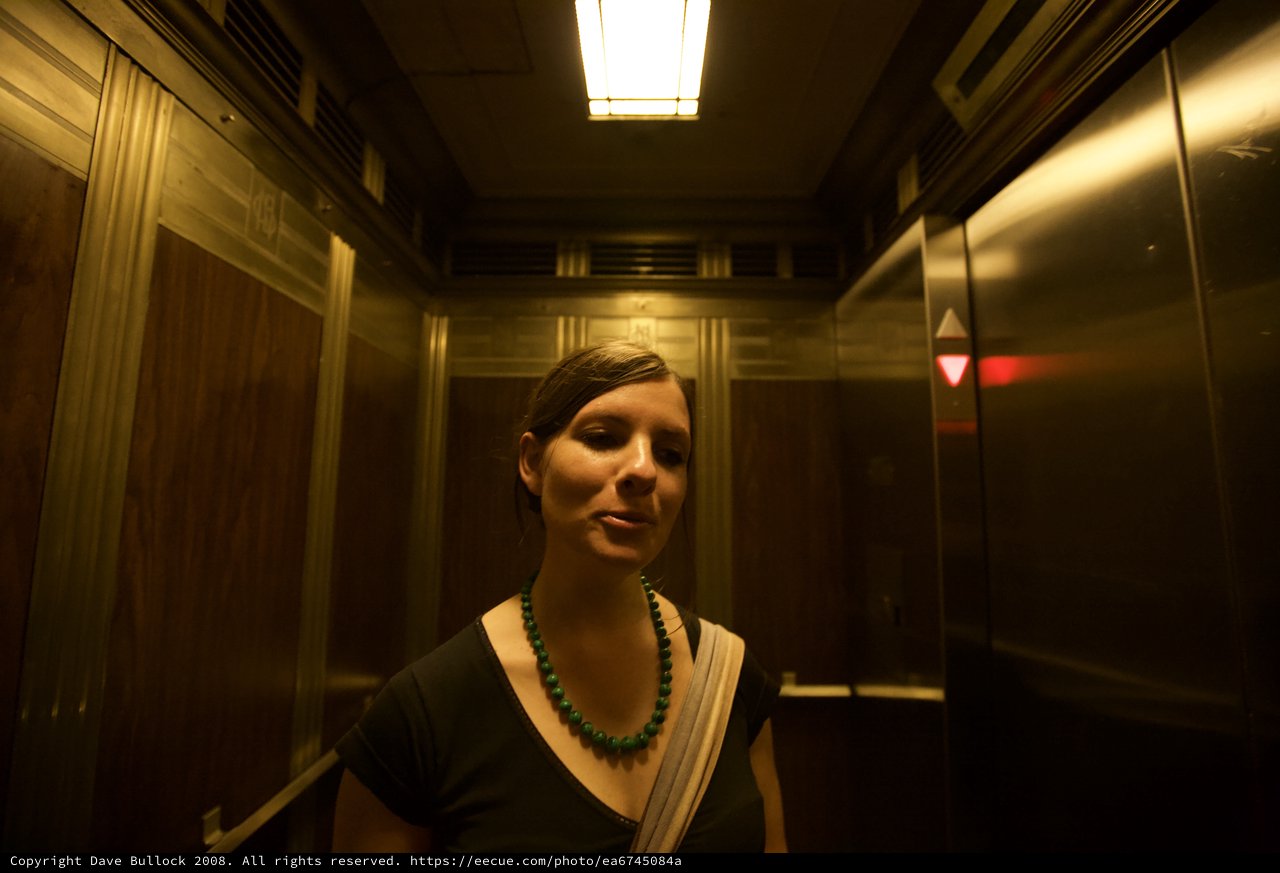 Woman in Vintage Elevator Warm Golden Light