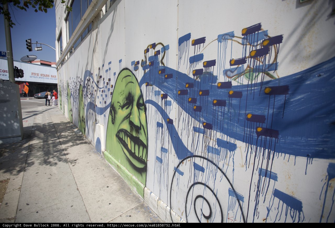 Artistic Mural of a Man with a Face on a Wall