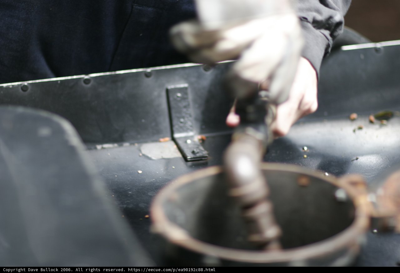 Pipe Pouring into Metal Container