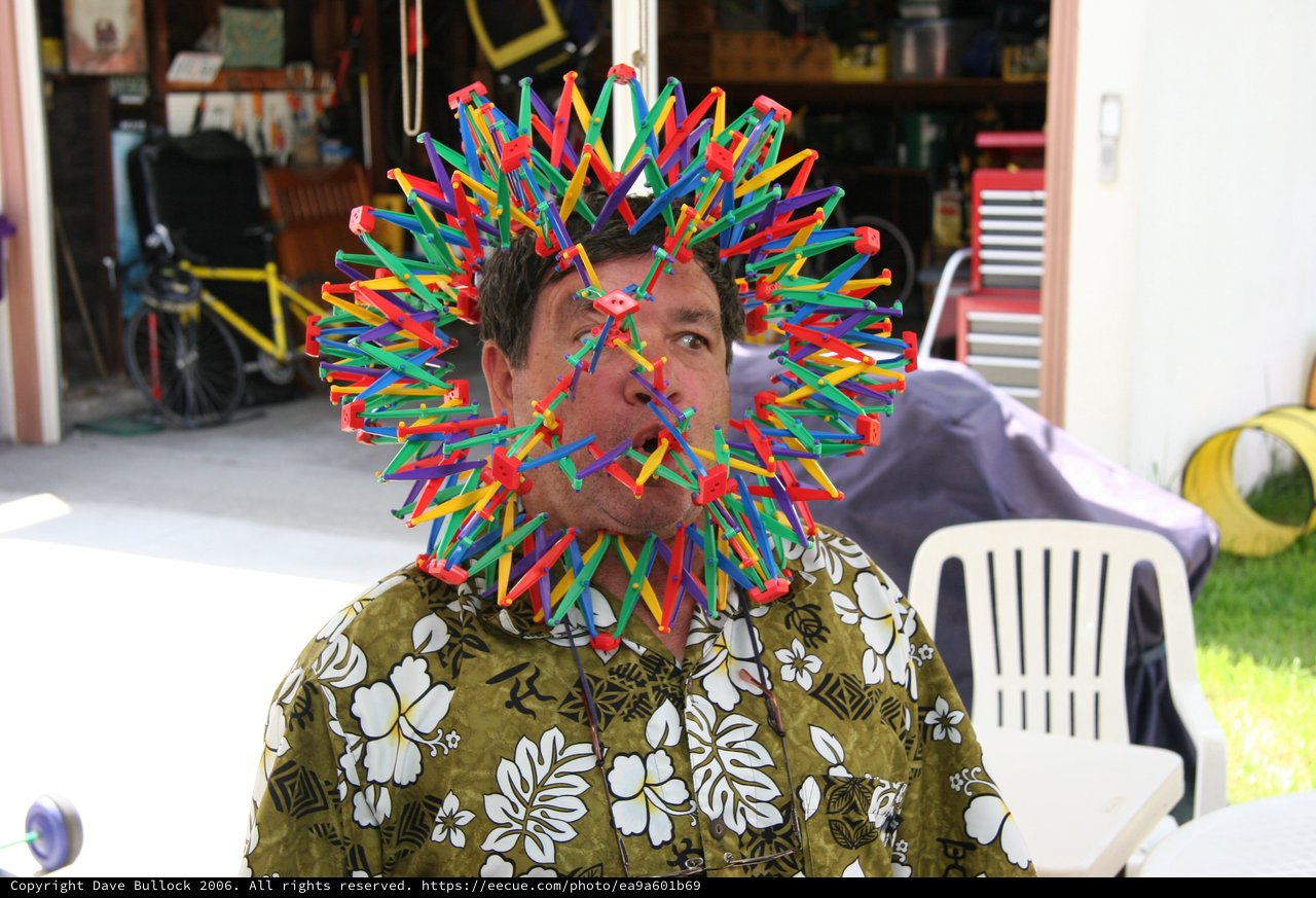 Man Wearing Elaborate K'Nex Toy Construction on Face