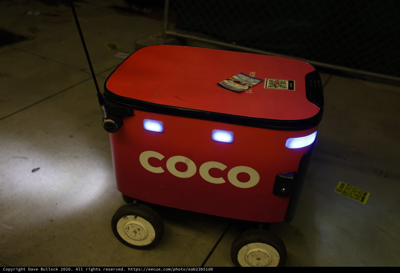 Coco Delivery Robot Navigating Nighttime Festival Grounds
