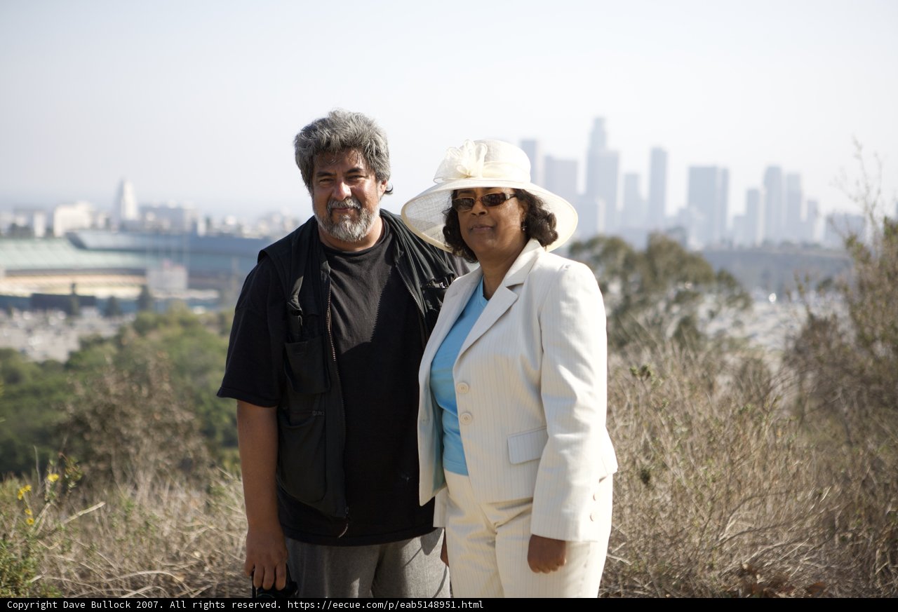 A Happy Couple in Front of the Cityscape