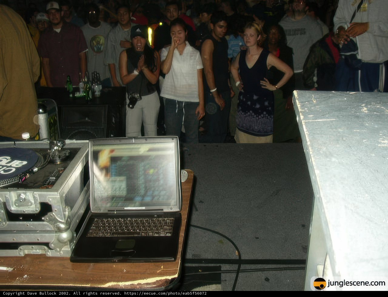 Nightclub DJ energizes the crowd with beats
