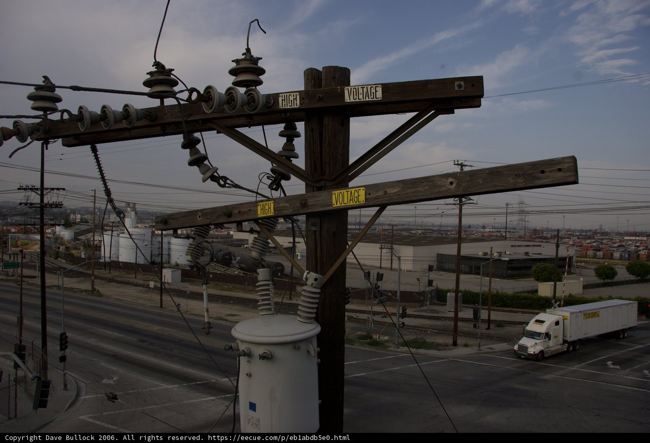 Parked Truck by a Utility Pole