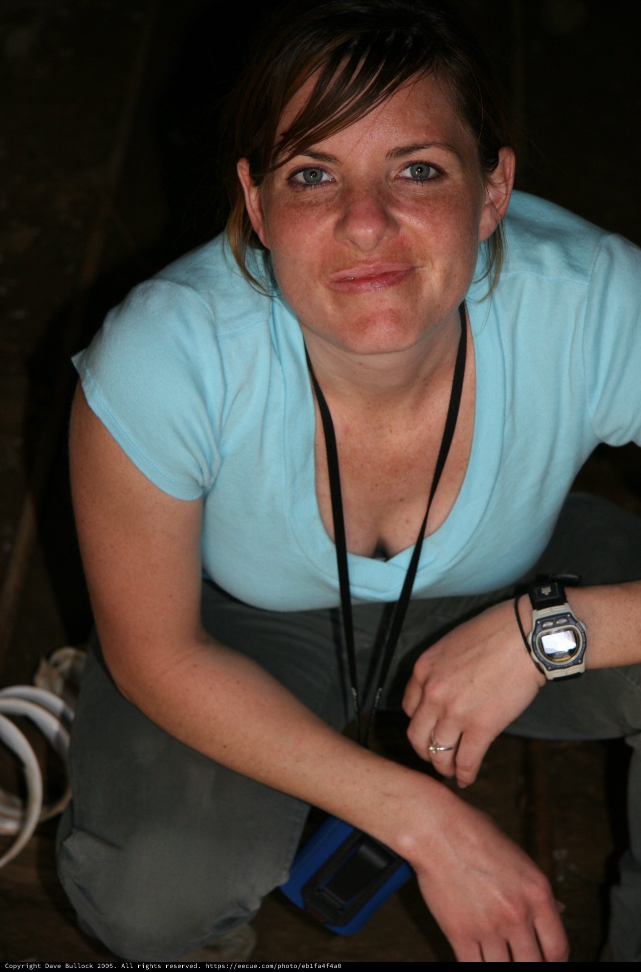 Woman Smiling in Dimly Lit Underground Tunnel