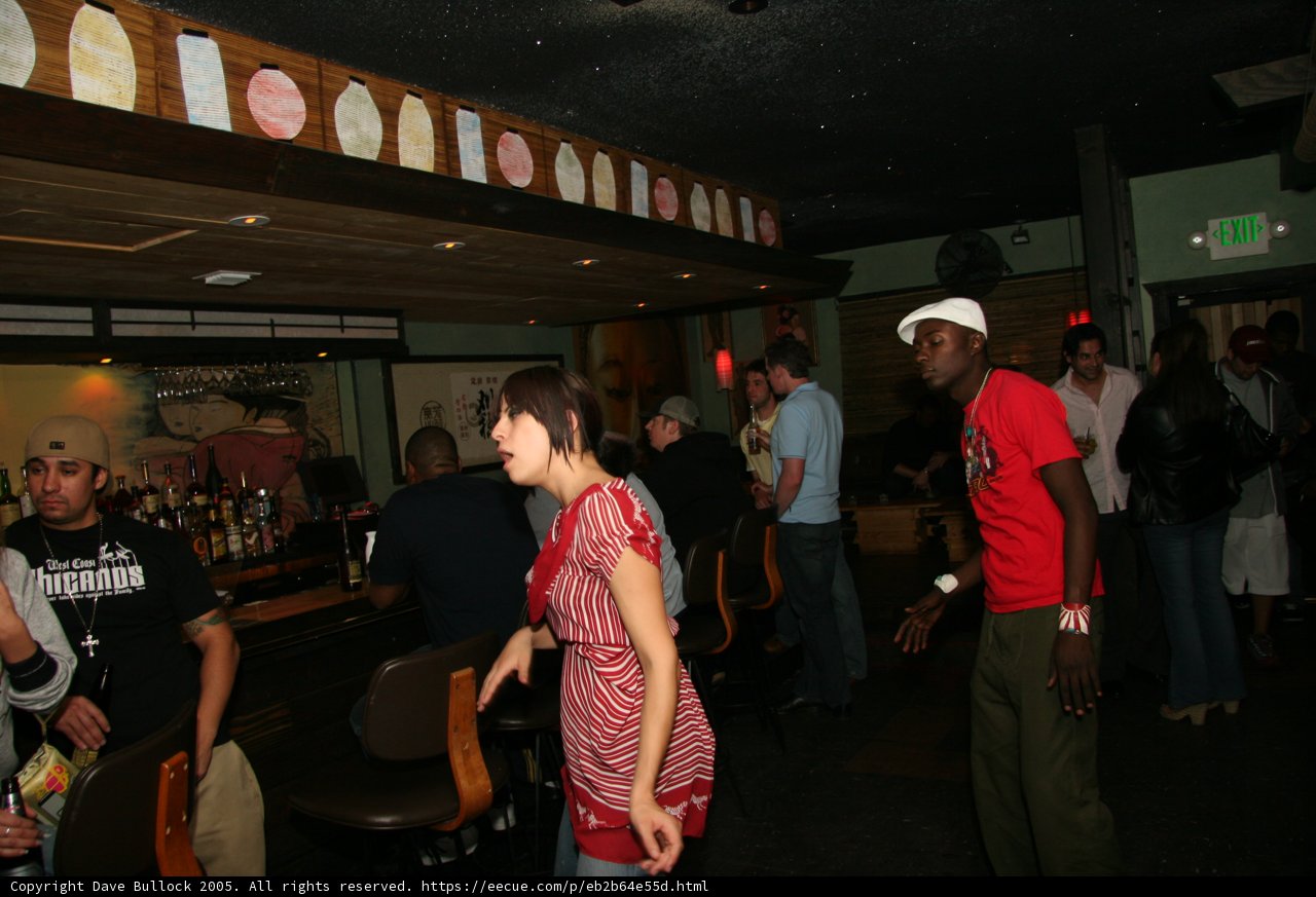Lady in Red at a Busy Bar