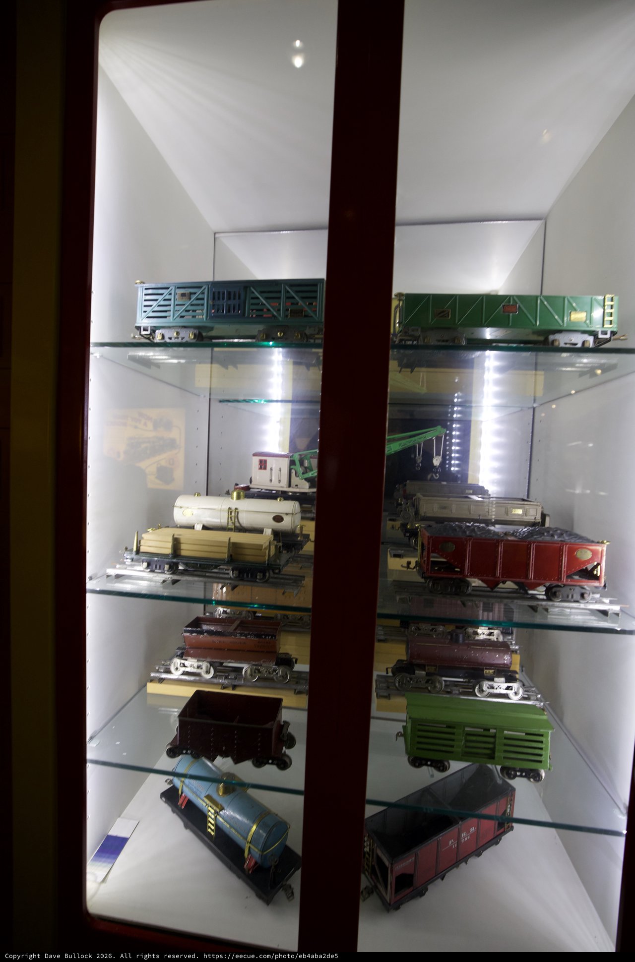Vintage Model Train Collection Display in Glass Cabinet