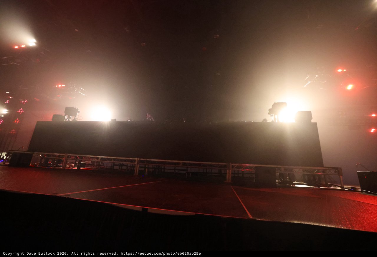 Massive DJ Stage Bathed in Hazy Concert Lights
