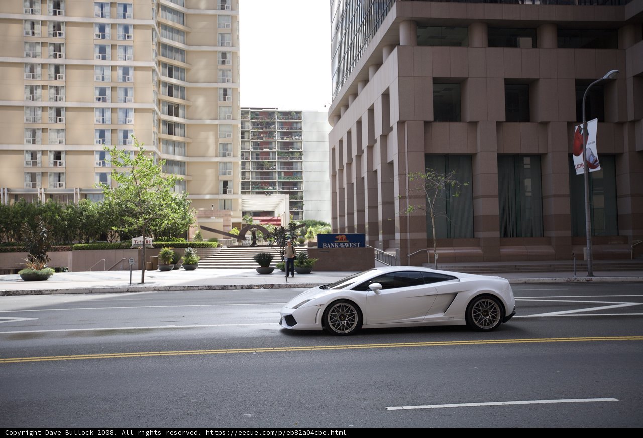 White Sports Car Cruising through the Metropolis