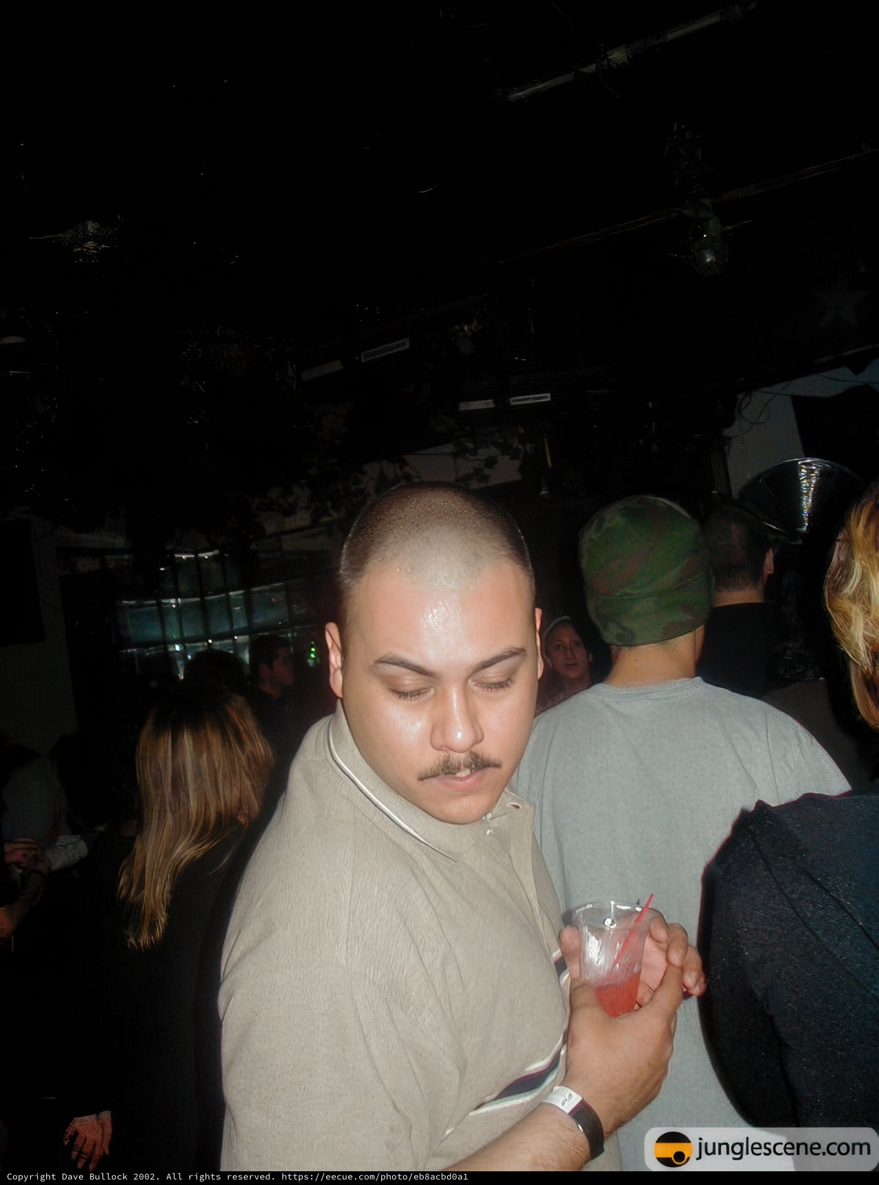 Shaved Head and Mustache Man at the Nightclub