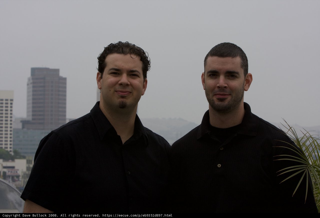 Two Men in Black T-Shirts Enjoying the Metropolis