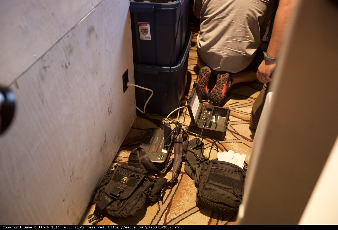 Man sorting through a room full of electronics and accessories