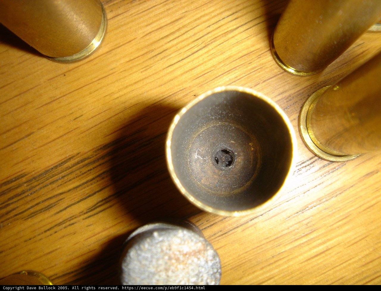 Brass Bullets on Hardwood Table