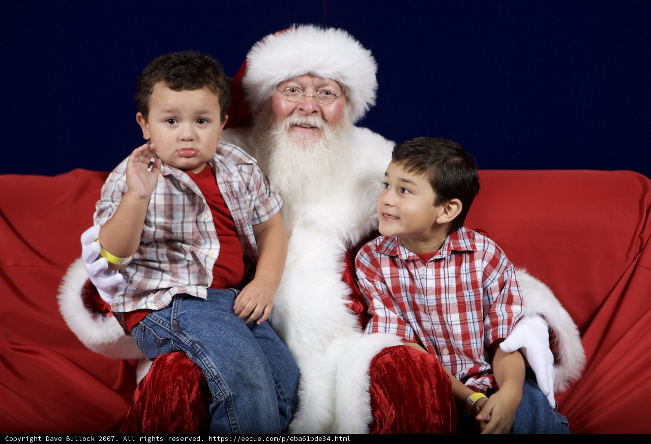 Santa Claus and Two Boys Sitting on Couch