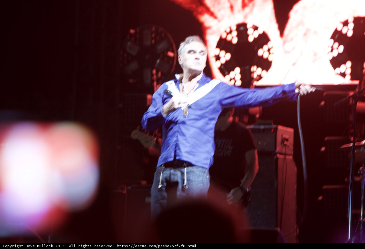 Morrissey Arms Outstretched Shirt Open Blue Motion Blur Circular Lights Red Screen Phone Blur