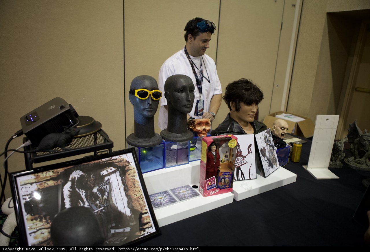 Man showcasing various consumer electronics and computer hardware